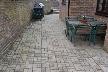 Before Pressure Tech cleaned the patio blockpaving in Chipstead