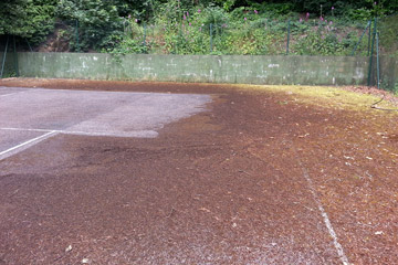 Before Pressure Tech cleaned the tennis court in Sevenoaks
