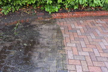 Before Pressure Tech cleaned the driveway and patio in Cudham